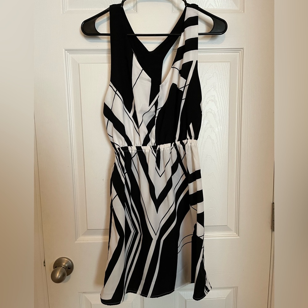 Black and white racer back dress. Elastic at the waist. Size S
